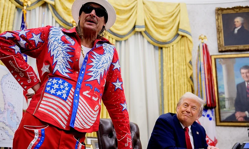 WASHINGTON, DC - MARCH 31: U.S. President Donald Trump listens as entertainer Kid Rock speaks during an executive order signing event in the Oval Office of the White House on March 31, 2025 in Washington, DC. Trump has signed an executive order against ticket scalping and reforming the live entertainment ticket industry. (Photo by Andrew Harnik/Getty Images)