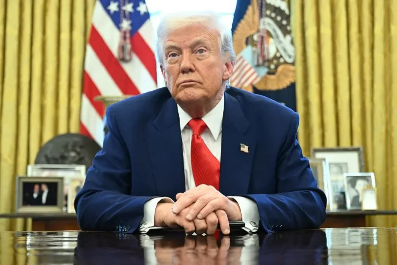 TOPSHOT - US President Donald Trump looks on after signing an executive order in the Oval Office of the White House on April 9, 2025 in Washington, DC. (Photo by SAUL LOEB / AFP) (Photo by SAUL LOEB/AFP via Getty Images)