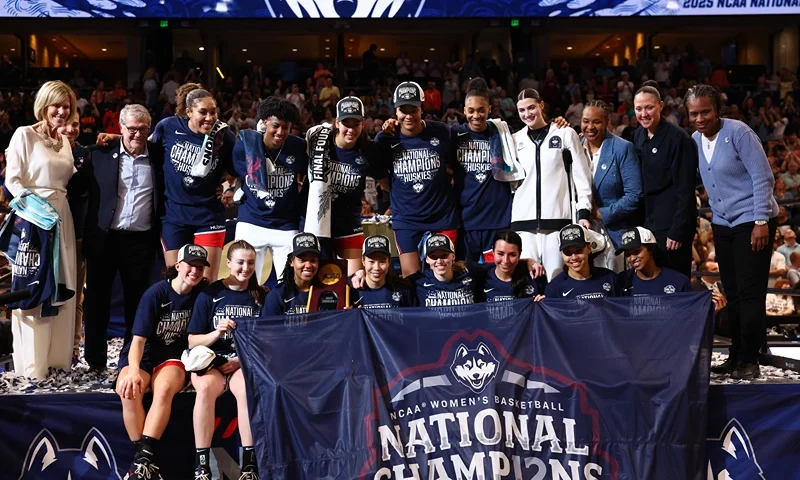 The UConn Huskies pose for photos during the trophy ceremony after beating the South Carolina Gamecocks 82-59 to win the National Championship of the NCAA Women's Basketball Tournament at Amalie Arena on April 06, 2025 in Tampa, Florida. (Photo by Maddie Meyer/Getty Images)