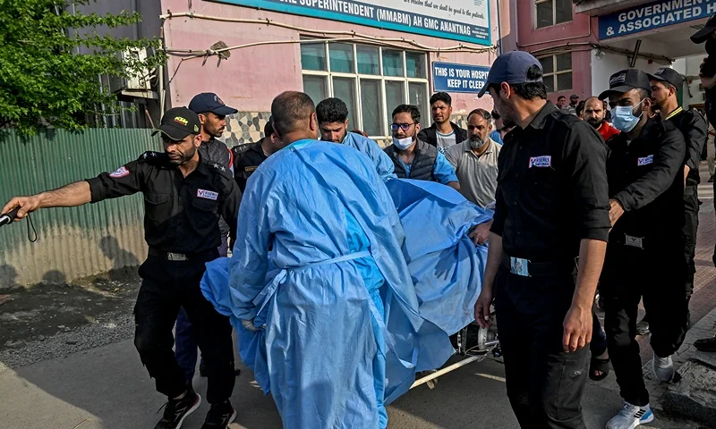 Paramedics and police personnel carry an injured tourist at a hospital in Anantnag, south of Srinagar, on April 22, 2025, following an attack. Gunmen in Indian-administered Kashmir opened fire on a group of tourists on April 22, with the chief minister saying the "inhuman" attack was one of the worst targeting civilians for years. At least five people were killed, a senior politician in the Himalayan region said. (Photo by Tauseef MUSTAFA / AFP) (Photo by TAUSEEF MUSTAFA/AFP via Getty Images)