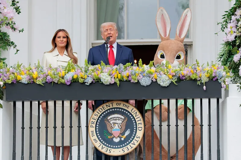 WASHINGTON, DC - APRIL 21: U.S. President Donald Trump, joined by first lady Melania Trump and the Easter Bunny, delivers remarks during the White House Egg Roll on the South Lawn of the White House on April 21, 2025 in Washington, DC. The White House is expecting thousands of children and adults to participate in the annual tradition of rolling colored eggs down the White House lawn, which was started by President Rutherford B. Hayes in 1878. (Photo by Anna Moneymaker/Getty Images)