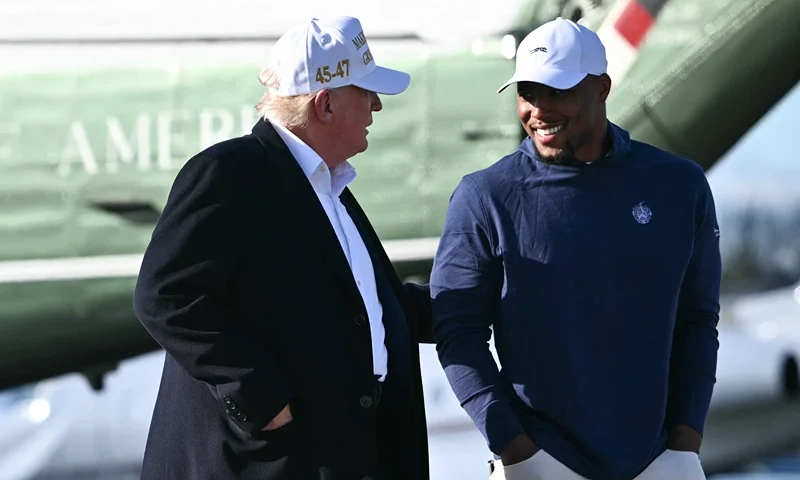 US President Donald Trump (L) walks with Philadelphia Eagles running back Saquon Barkley before boarding Air Force One Morristown Municipal Airport in Morristown, New Jersey, on April 27, 2025. Trump is returning to Washington, DC, from his residence in Bedminster, New Jersey, after traveling to Rome for the funeral of Pope Francis. (Photo by Mandel NGAN / AFP) (Photo by MANDEL NGAN/AFP via Getty Images)
