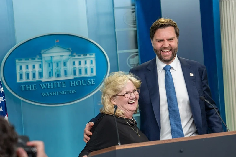 Vice President JD Vance laughs with his mother, Beverly Aikins, at the podium in the White House press briefing room in Washington, D.C. | Emily Higgins/Provided by The White House