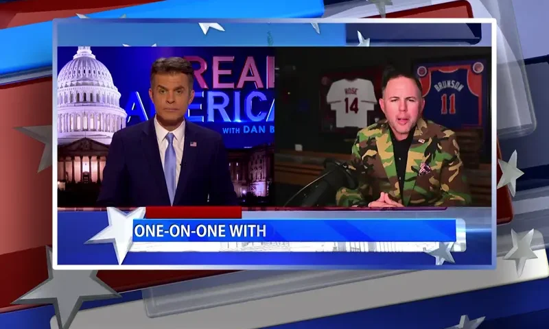 Video still from Real America on One America News Network showing a split screen of the host on the left side, and on the right side is the guest, John Rourke.