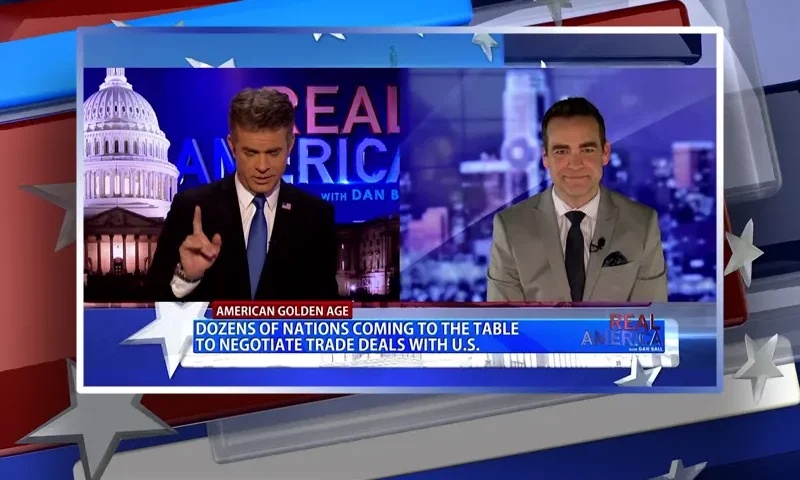 Video still from Real America on One America News Network showing a split screen of the host on the left side, and on the right side is the guest, Seth Denson.