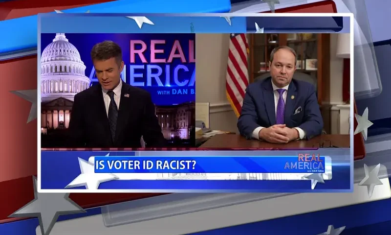 Video still from Real America on One America News Network showing a split screen of the host on the left side, and on the right side is the guest, Rep. Marlin Stutzman.