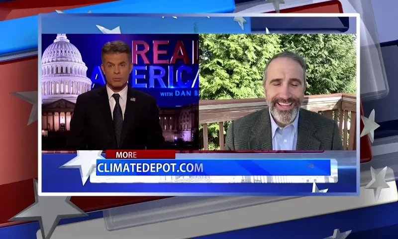 Video still from Real America on One America News Network showing a split screen of the host on the left side, and on the right side is the guest, Marc Morano.