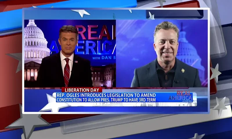 Video still from Real America on One America News Network showing a split screen of the host on the left side, and on the right side is the guest, Rep. Andy Ogles.