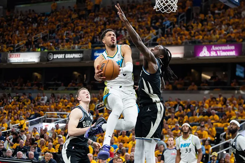 Indiana Pacers guard Tyrese Haliburton (0) shoots the ball while Milwaukee Bucks forward Taurean Prince (12) defends during game five of the first round for the 2024 NBA Playoffs at Gainbridge Fieldhouse. Mandatory Credit: Trevor Ruszkowski-Imagn Images