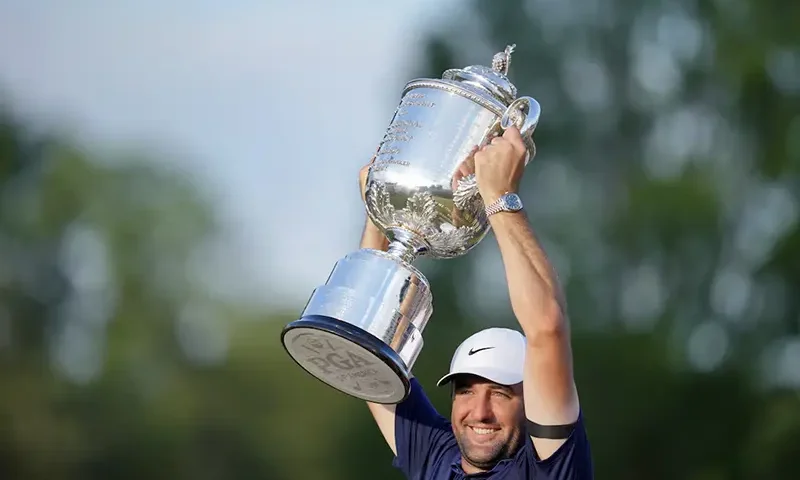 Scottie Scheffler holds up his trophy after winning the PGA Championship golf tournament at Quail Hollow. Mandatory Credit: Jim Dedmon-Imagn Images
