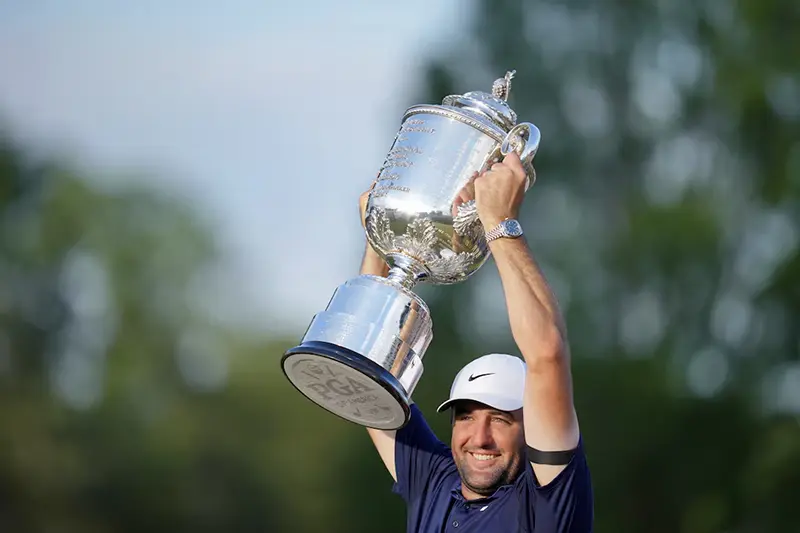 Scottie Scheffler holds up his trophy after winning the PGA Championship golf tournament at Quail Hollow. Mandatory Credit: Jim Dedmon-Imagn Images