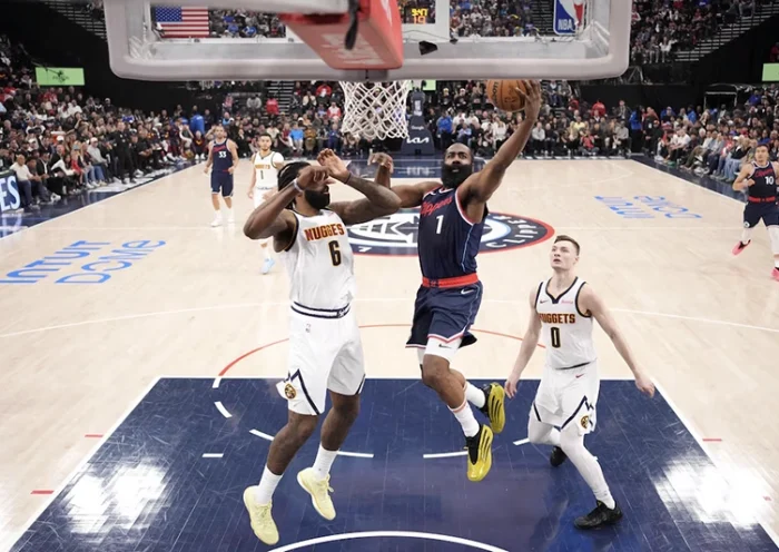 LA Clippers guard James Harden (1) shoots the ball against Denver Nuggets center DeAndre Jordan (6) and guard Christian Braun (0) in the first half during game six of first round for the 2025 NBA Playoffs at Intuit Dome. Mandatory Credit: Kirby Lee-Imagn Images