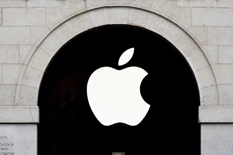 Apple logo is seen on the Apple store at The Marche Saint Germain in Paris, France July 15, 2020. REUTERS/Gonzalo Fuentes/File Photo/File Photo