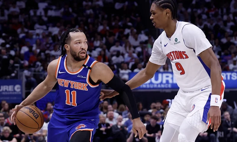 New York Knicks guard Jalen Brunson (11) is defended by Detroit Pistons forward Ausar Thompson (9) in the first half during game six of first round for the 2024 NBA Playoffs at Little Caesars Arena. Mandatory Credit: Rick Osentoski-Imagn Images