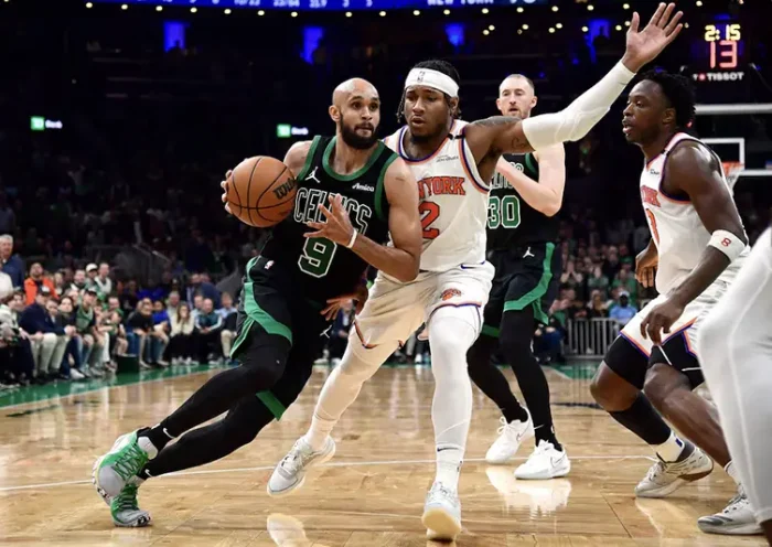 Boston Celtics guard Derrick White (9) controls the ball while New York Knicks guard Miles McBride (2) defends in the second half during game five of the second round for the 2025 NBA Playoffs at TD Garden. Mandatory Credit: Bob DeChiara-Imagn Images