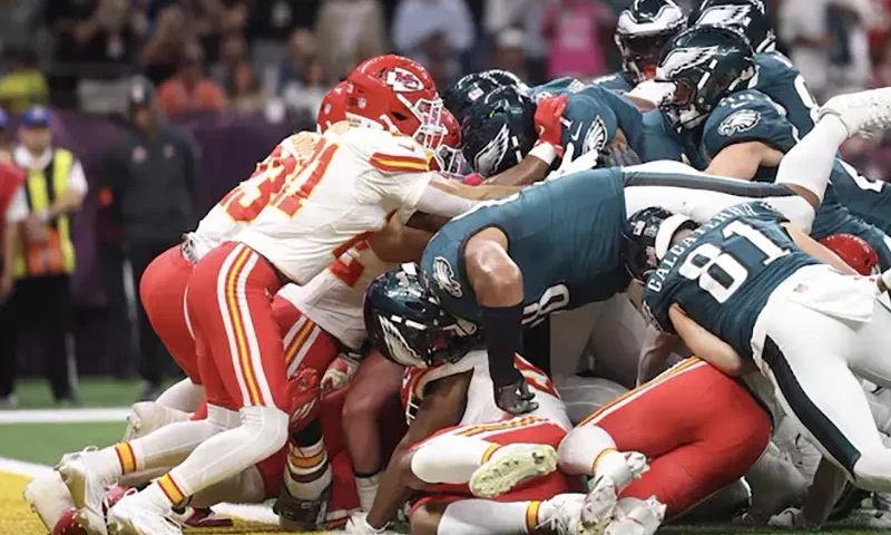 Philadelphia Eagles quarterback Jalen Hurts (1) scores a touchdown against the Kansas City Chiefs in the first quarter in Super Bowl LIX at Ceasars Superdome. Mandatory Credit: Mark J. Rebilas-Imagn Images