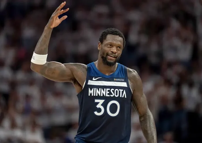 Minnesota Timberwolves forward Julius Randle (30) raises his arm to pump up the crowd after making a shot against the Golden State Warriors in the first half during game five of the second round for the 2025 NBA Playoffs at Target Center. Mandatory Credit: Jesse Johnson-Imagn Images