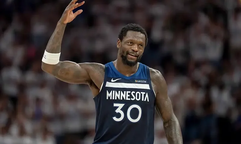 Minnesota Timberwolves forward Julius Randle (30) raises his arm to pump up the crowd after making a shot against the Golden State Warriors in the first half during game five of the second round for the 2025 NBA Playoffs at Target Center. Mandatory Credit: Jesse Johnson-Imagn Images