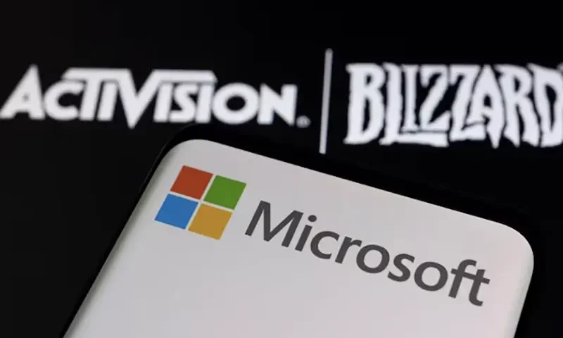 Microsoft logo is seen on a smartphone placed on displayed Activision Blizzard logo in this illustration taken January 18, 2022. REUTERS/Dado Ruvic/Illustration/File Photo