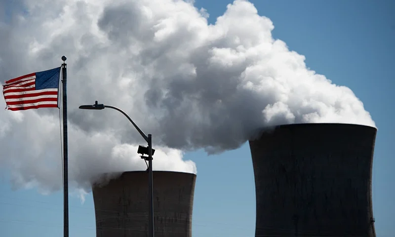 Steam rises out of the nuclear plant on Three Mile Island, with the operational plant run by Exelon Generation, in Middletown, Pennsylvania on March 26, 2019. - Forty years after the partial meltdown at the Three Mile Island nuclear plant, John Garver can still recall the smell and a metallic taste in his mouth."It's time to shut it down," said Garver, a former salesman who was 40 years old when the accident occurred on March 28, 1979 and is now pushing 80."I was against it from the beginning," said Garver, who is retired but works part-time at the Middletown boat club on the banks of the Susquehanna River."I'm against it now and I was hoping in my lifetime that it will close down," he added, gazing from beneath a worn red fisherman's cap at the giant cooling towers spitting out vapor into a cloudless sky."Maybe I'll get my wish."He just might. (Photo by Andrew CABALLERO-REYNOLDS / AFP) (Photo by ANDREW CABALLERO-REYNOLDS/AFP via Getty Images)