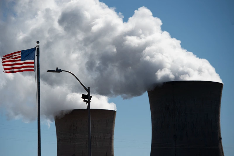 Steam rises out of the nuclear plant on Three Mile Island, with the operational plant run by Exelon Generation, in Middletown, Pennsylvania on March 26, 2019. - Forty years after the partial meltdown at the Three Mile Island nuclear plant, John Garver can still recall the smell and a metallic taste in his mouth."It's time to shut it down," said Garver, a former salesman who was 40 years old when the accident occurred on March 28, 1979 and is now pushing 80."I was against it from the beginning," said Garver, who is retired but works part-time at the Middletown boat club on the banks of the Susquehanna River."I'm against it now and I was hoping in my lifetime that it will close down," he added, gazing from beneath a worn red fisherman's cap at the giant cooling towers spitting out vapor into a cloudless sky."Maybe I'll get my wish."He just might. (Photo by Andrew CABALLERO-REYNOLDS / AFP) (Photo by ANDREW CABALLERO-REYNOLDS/AFP via Getty Images)