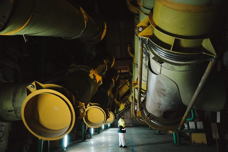 TOPSHOT - This photograph taken on January 26, 2023, shows an employee standing in the manufacturing workshop Georges Besse 1, an Uranium enrichment site at the Tricastin nuclear power plant in Saint-Paul-Trois-Chateau, southern France. (Photo by OLIVIER CHASSIGNOLE / AFP) (Photo by OLIVIER CHASSIGNOLE/AFP via Getty Images)