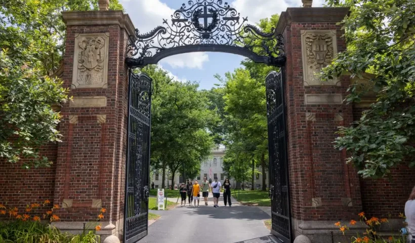 CAMBRIDGE, MASSACHUSETTS - JUNE 29: People walk through the gate on Harvard Yard at the Harvard University campus on June 29, 2023 in Cambridge, Massachusetts. The U.S. Supreme Court ruled that race-conscious admission policies used by Harvard and the University of North Carolina violate the Constitution, bringing an end to affirmative action in higher education. (Photo by Scott Eisen/Getty Images)