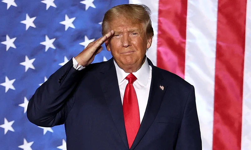 U.S. President Donald Trump salutes supporters during a campaign rally at Minden-Tahoe Airport on October 08, 2022 in Minden, Nevada. Former U.S. President Donald Trump held a campaign style rally for Nevada GOP candidates ahead of the state's midterm election on November 8th. (Photo by Justin Sullivan/Getty Images)