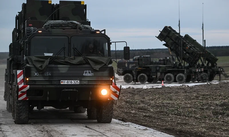 ZAMOSC, POLAND - FEBRUARY 18: A German soldier drives a M983 HEMTT carrying a Patriot launcher module part of the US made MIM-104 Patriot surface-to-air missile (SAM) system on a open field on February 18, 2023 in Zamosc, Poland. The German armed forces deployed Patriots batteries to their NATO neighbor, after a missile explosion in Przewodow, which previous investigation suggests that came from Ukrainian air defense, killed two civilians. Since Russia's large scale military attack on Ukraine on February 24, 2022 more than 9.7 million refugees from Ukraine crossed the Polish borders to escape the conflict, with 1.4 million registering in Poland whilst others moved on to other countries. (Photo by Omar Marques/Getty Images)