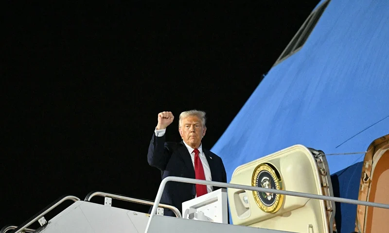 TOPSHOT - US President Donald Trump boards Air Force One at Naval Air Station Joint Reserve Base New Orleans in Louisiana on February 9, 2025, as he returns to Washington, DC, after attending Super Bowl LIX. (Photo by ROBERTO SCHMIDT / AFP) (Photo by ROBERTO SCHMIDT/AFP via Getty Images)