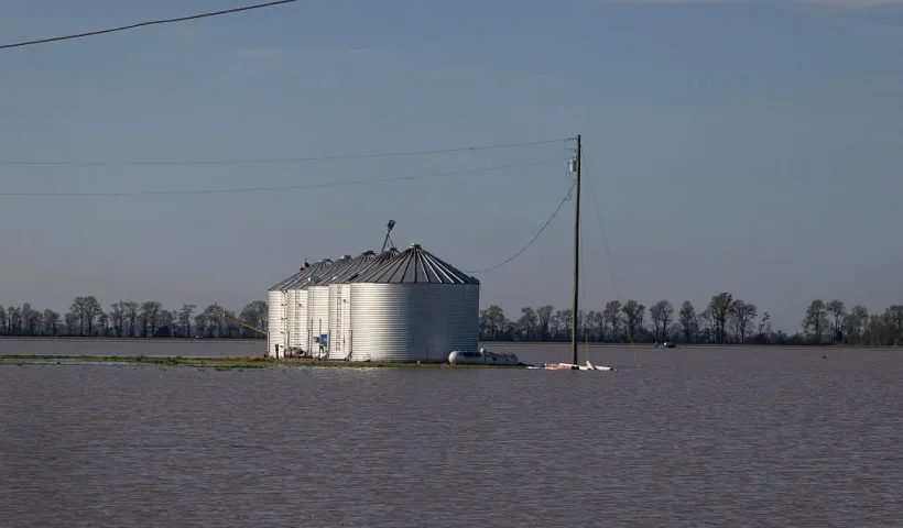SIKESTON, MISSOURI - APRIL 07: Floodwater surrounds grain bins following large storms on April 07, 2025 near Sikeston, Missouri. Thunderstorms, heavy rains, high winds, and tornadoes have plagued the central region of the U.S. for the past several days, causing widespread damage before moving east. (Photo by Scott Olson/Getty Images)