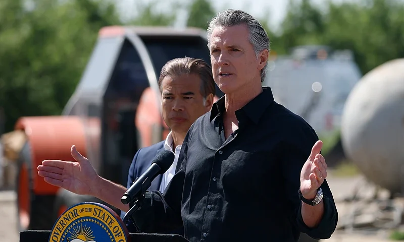 California Governor Gavin Newsom (R) speaks as California Attorney general Rob Bonta looks on during a news conference at Gemperle Orchard. (Photo by Justin Sullivan/Getty Images)