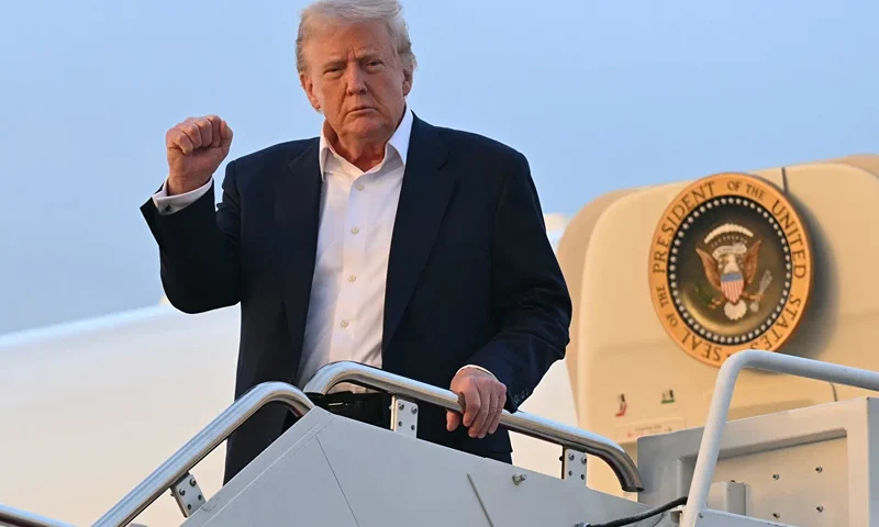 TOPSHOT - US President Donald Trump disembarks from Air Force One upon arrival at Joint Base Andrews in Maryland, May 4, 2025, as he returns to the WHite House after spending the weekend in Florida. (Photo by SAUL LOEB / AFP) (Photo by SAUL LOEB/AFP via Getty Images)