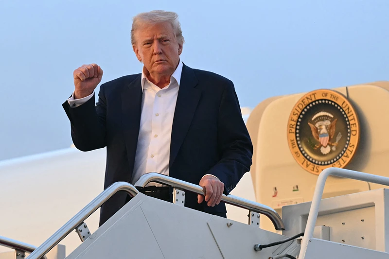 TOPSHOT - US President Donald Trump disembarks from Air Force One upon arrival at Joint Base Andrews in Maryland, May 4, 2025, as he returns to the WHite House after spending the weekend in Florida. (Photo by SAUL LOEB / AFP) (Photo by SAUL LOEB/AFP via Getty Images)