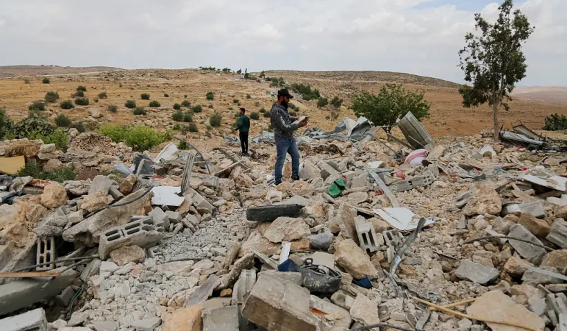 Palestinians investigate the area after armed Israeli army personnel, accompanied by bulldozers destroyed Palestinian structures in Hebron, West Bank, on May 5, 2025. According to reports, Israel destoryed 150 Palestinian buildings and structures in West Bank in April only. (Photo by Mosab shawer / Middle East Images / Middle East Images via AFP) (Photo by MOSAB SHAWER/Middle East Images/AFP via Getty Images)