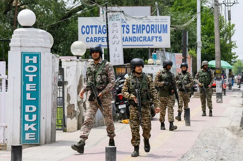 Indian security forces patrol a road near Dal Lake in Srinagar, India, on May 6, 2025. Increased military presence follows the April 22 attack on tourists in Pahalgam, amid rising tensions between India and Pakistan. (Photo by Basit Zargar / Middle east images / Middle East Images via AFP) (Photo by BASIT ZARGAR/Middle east images/AFP via Getty Images)