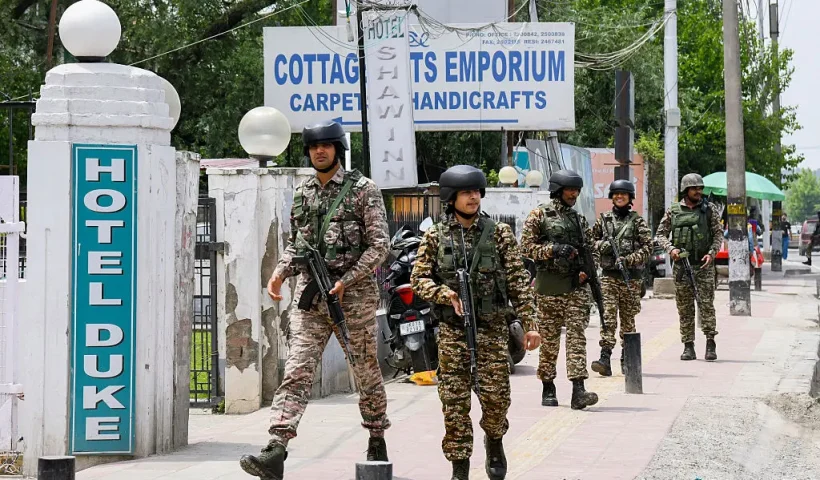 Indian security forces patrol a road near Dal Lake in Srinagar, India, on May 6, 2025. Increased military presence follows the April 22 attack on tourists in Pahalgam, amid rising tensions between India and Pakistan. (Photo by Basit Zargar / Middle east images / Middle East Images via AFP) (Photo by BASIT ZARGAR/Middle east images/AFP via Getty Images)