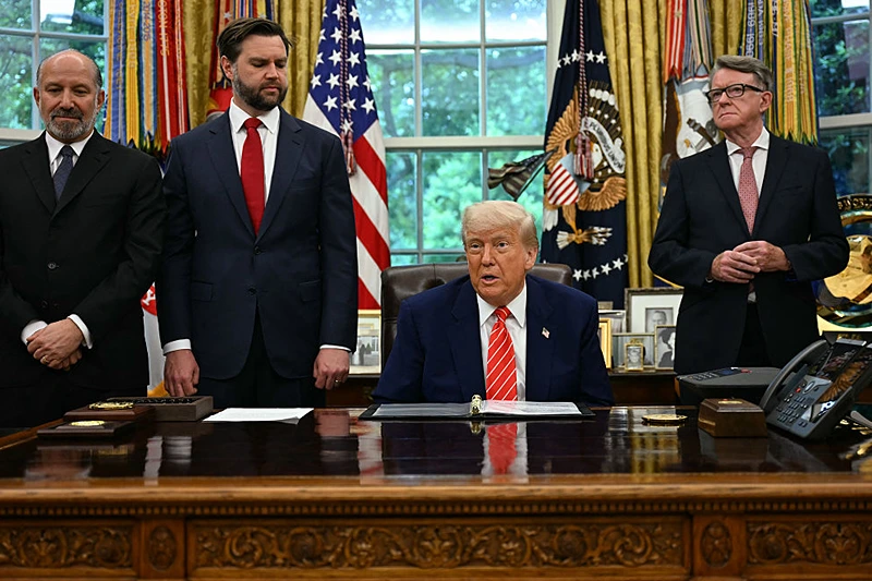 US President Donald Trump makes a trade announcement as US Secretary of Commerce Howard Lutnick (L), US Vice President JD Vance (2L), and British ambassador to the United States Peter Mandelson look on in the Oval Office of the White House in Washington, DC, on May 8, 2025. US President Donald Trump on announced a "full and comprehensive" trade agreement with Britain, which would be the first such deal since he launched his global tariffs blitz. (Photo by Jim WATSON / AFP) (Photo by JIM WATSON/AFP via Getty Images)