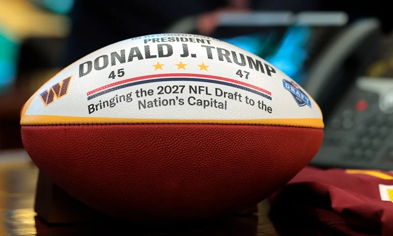 A football honoring the 2027 NFL Draft is seen as U.S. President Donald Trump speaks on the draft in the Oval Office of the White House on May 05, 2025 in Washington, DC. President Trump announced that the 2027 NFL Draft will be held on the National Mall. (Photo by Anna Moneymaker/Getty Images)