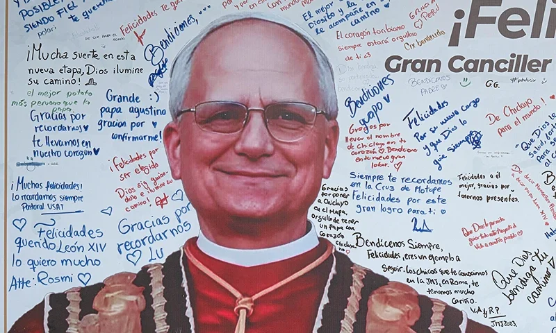 Messages are written on a banner with an image of Pope Leo XIV at the Santo Toribio de Mogrovejo Catholic University in Chiclayo, Lambayeque region, northern Peru, on May 12, 2025. The world is still getting to know the modest and soft-spoken pontiff born in Chicago, who spent much of his life in the priesthood as a missionary in Peru, where he holds a second citizenship. (Photo by Ernesto BENAVIDES / AFP) (Photo by ERNESTO BENAVIDES/AFP via Getty Images)