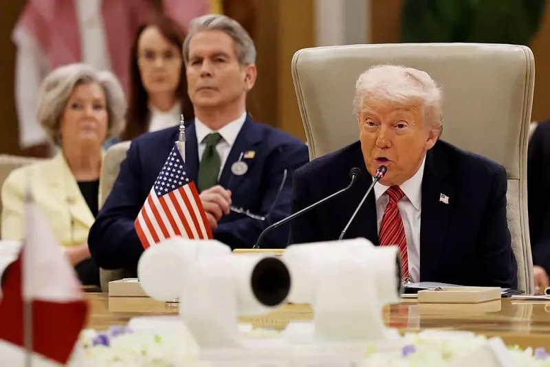 RIYADH, SAUDI ARABIA - MAY 14: U.S. President Donald Trump speaks during the Gulf Cooperation Council (GCC) Leaders’ Summit at The Ritz-Carlton on May 14, 2025 in Riyadh, Saudi Arabia. U.S. Treasury Secretary Scott Bessent and White House Chief of Staff Susie Wiles appear on the left. The council addresses regional stability, defense cooperation, and energy policy among Gulf nations. Trump is on a multi-nation tour of the Gulf region focused on expanding economic ties and reinforcing security cooperation with key U.S. allies. (Photo by Win McNamee/Getty Images)