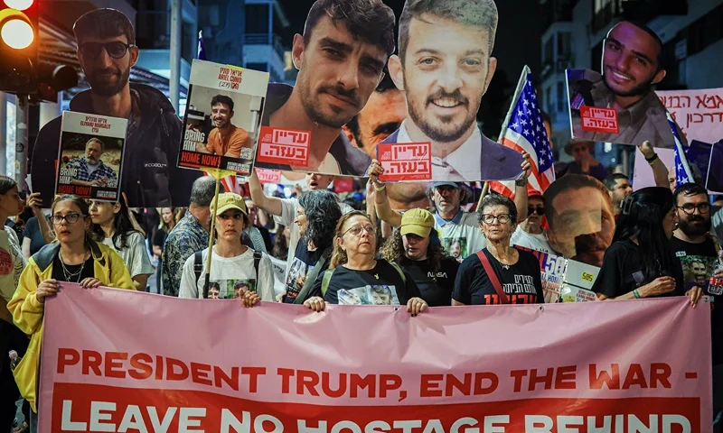 Israelis march to demand freedom of all of the hostages held in Gaza, and call on US officials, including President Trump, to intervene for their release near the US embassy in Tel Aviv, Israel, on May 13, 2025. (Photo by Itai Ron / Middle East Images / Middle East Images via AFP) (Photo by ITAI RON/Middle East Images/AFP via Getty Images)