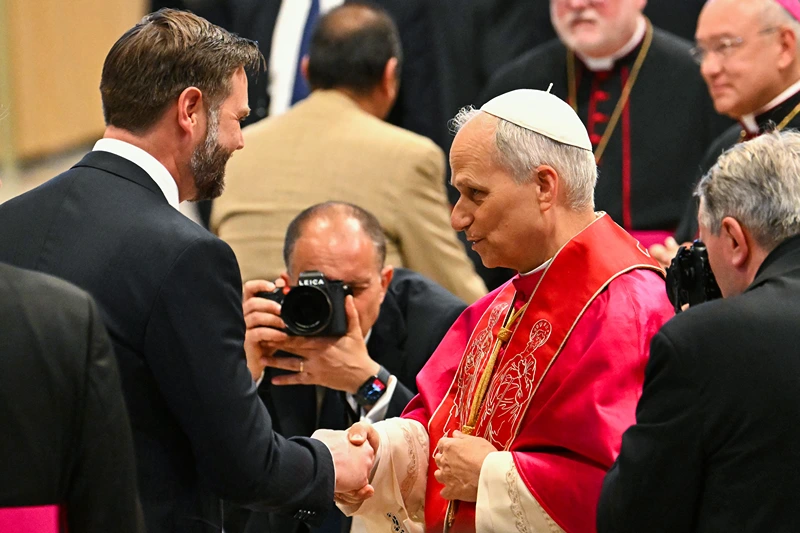 Pope Leo XIV talks to US Vice President JD Vance (L) after a Holy mass for the beginning of his pontificate, in St Peter's basilica in The Vatican on May 18, 2025. (Photo by Alberto PIZZOLI / AFP) (Photo by ALBERTO PIZZOLI/AFP via Getty Images)