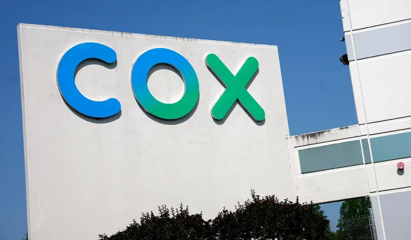 SPRINGFIELD, VIRGINIA - MAY 16: A Cox sign is seen on the Cox Communications Springfield Warehouse on May 16, 2025 in Springfield, Virginia. Cable Giants Charter and Cox agree to merge in $34.5 billion deal that, if approved, would create one of the largest TV and internet providers in the United States. (Photo by Kevin Dietsch/Getty Images)SPRINGFIELD, VIRGINIA - MAY 16: A Cox sign is seen on the Cox Communications Springfield Warehouse on May 16, 2025 in Springfield, Virginia. Cable Giants Charter and Cox agree to merge in $34.5 billion deal that, if approved, would create one of the largest TV and internet providers in the United States. (Photo by Kevin Dietsch/Getty Images)