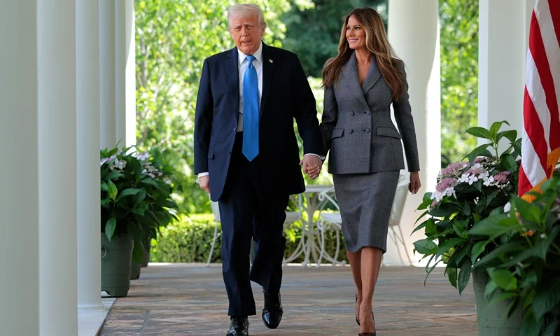 WASHINGTON, DC - MAY 19: U.S. President Donald Trump and first lady Melania Trump arrive at the signing ceremony for the TAKE IT DOWN Act in the Rose Garden of the White House on May 19, 2025 in Washington, DC. The first lady made the Tools to Address Known Exploitation by Immobilizing Technological Deepfakes on Websites and Networks (TAKE IT DOWN) Act a priority, traveling to Capitol Hill to lobby lawmakers and show her support for the legislation, which addresses non-consensual intimate imagery, or "revenge porn," and artificial intelligence deepfakes posted online and to social media. (Photo by Chip Somodevilla/Getty Images)