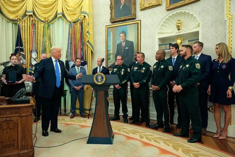 WASHINGTON, DC - MAY 19: U.S. President Donald Trump speaks to the loved ones of fallen Palm Beach County Sheriff's Deputies as he posthumously awards Medals of Sacrifice during a ceremony in the Oval Office of the White House on May 19, 2025 in Washington, DC. Trump awarded Medals of Sacrifice to Palm Beach County Sheriff's Office deputies Ralph "Butch" Waller Jr., Corporal Luis Paez, and Deputy Ignacio "Dan" Diaz, who died in a line-of-duty crash on November 21, 2024. (Photo by Chip Somodevilla/Getty Images)