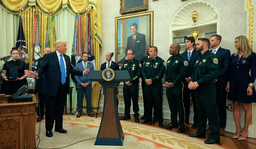 WASHINGTON, DC - MAY 19: U.S. President Donald Trump speaks to the loved ones of fallen Palm Beach County Sheriff's Deputies as he posthumously awards Medals of Sacrifice during a ceremony in the Oval Office of the White House on May 19, 2025 in Washington, DC. Trump awarded Medals of Sacrifice to Palm Beach County Sheriff's Office deputies Ralph "Butch" Waller Jr., Corporal Luis Paez, and Deputy Ignacio "Dan" Diaz, who died in a line-of-duty crash on November 21, 2024. (Photo by Chip Somodevilla/Getty Images)