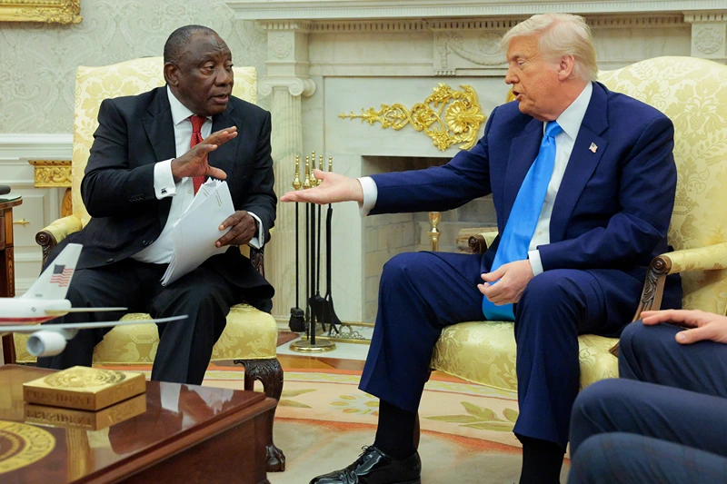President of South Africa Cyril Ramaphosa (L) and U.S. President Donald Trump exchange words during a meeting in the Oval Office of the White House on May 21, 2025 in Washington, DC. Relations between the two countries have been strained since Trump signed an executive order in February that claimed white South Africans are the victims of government land confiscation and race-based “genocide” while admitting some of those Afrikaners as refugees to the United States. Trump also halted all foreign aid to South Africa and expelled the country’s Ambassador to the U.S. Ebrahim Rasool. (Photo by Chip Somodevilla/Getty Images)