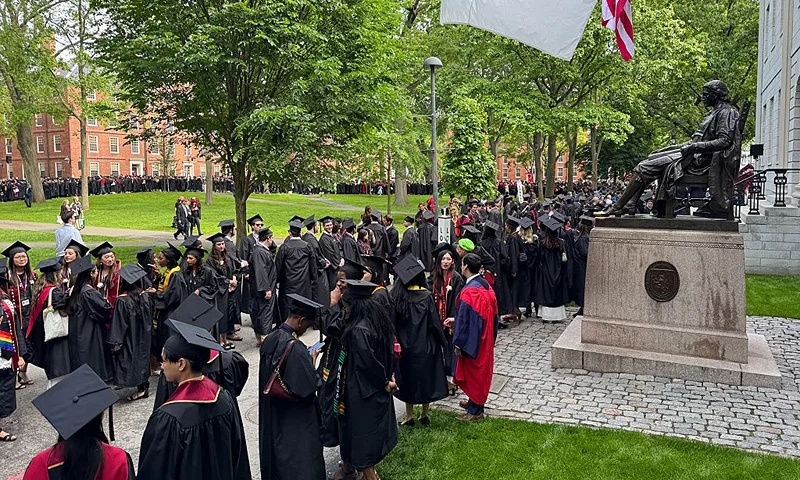 Graduates gather before the start of the commencement ceremony at Harvard University in Cambridge, Massachusetts, on May 29, 2025. US President Donald Trump is furious at Harvard for rejecting his administration's push for oversight on admissions and hiring, amid the president's claims the school is a hotbed of anti-Semitism and "woke" liberal ideology. (Photo by Rick Friedman / AFP) (Photo by RICK FRIEDMAN/AFP via Getty Images)
