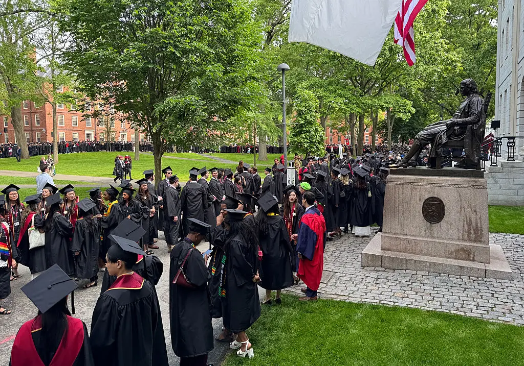 Graduates gather before the start of the commencement ceremony at Harvard University in Cambridge, Massachusetts, on May 29, 2025. US President Donald Trump is furious at Harvard for rejecting his administration's push for oversight on admissions and hiring, amid the president's claims the school is a hotbed of anti-Semitism and "woke" liberal ideology. (Photo by Rick Friedman / AFP) (Photo by RICK FRIEDMAN/AFP via Getty Images)